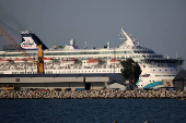 A view of the Crown Iris, a vessel which will be used to assist in the departure of Israelis from Cyprus,  is seen at the port of Larnaca,