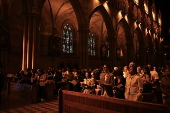 Worshippers participate in Stations of the Cross at St Mary’s Catholic Cathedral in Sydney
