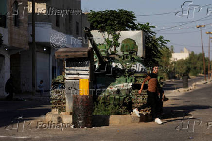 Man walks on a street, at Bosra al-Sham town