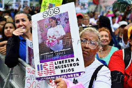 Demonstrators march to demand the return of Venezuelan migrant children after their parents were deported from the U.S., in Caracas