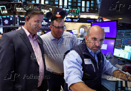 Traders work on the floor of the NYSE in New York