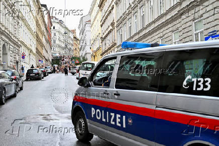 FILE PHOTO: Fans gather after the government confirmed a planned attack at the venue of three Taylor Swift concerts, in Vienna