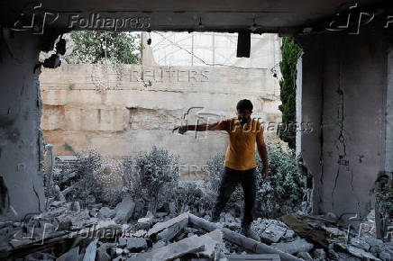 Israeli army demolishes the house of a Palestinian assailant, in Hebron