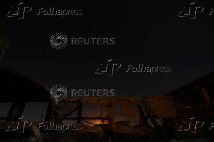 A meteor streaks across the sky, in Qamishli