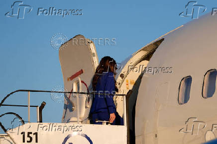 U.S. Homeland Security Secretary Kristi Noem, center, boards a plane as she prepares to depart the Rzeszow-Jasionka Airport, in Rzeszow