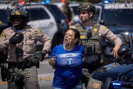 Standoff by protesters and law enforcement, following multiple detentions by ICE in Los Angeles County