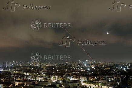 A missile launched from Iran is intercepted as seen from Ashkelon