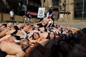 Protesters demonstrate for the permanent end of bullfighting and running of the bulls, a day before the start of the the San Fermin festival, in Pamplona