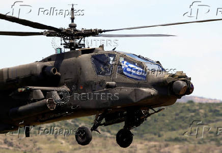 A Greek Apache helicopter flies as NATO holds training exercise 'Immediate Response' drills with host nations Albania, Bulgaria, Croatia, Greece, Kosovo, Montenegro, and North Macedonia, at Krivolak