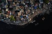 A drone view shows shanties near the polluted Pasig River on World Environment Day in Manila