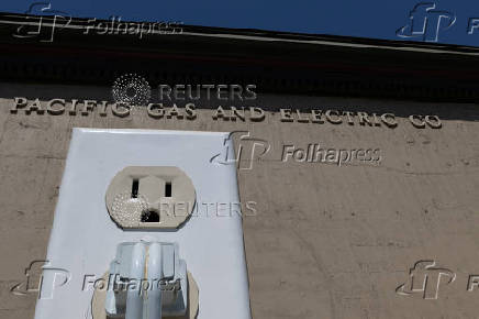 A giant electrical outlet is displayed at a PG&E substation building in Petaluma, California