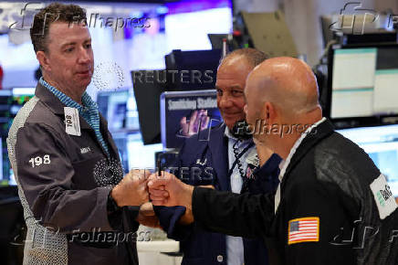 Traders work on the floor of the NYSE in New York