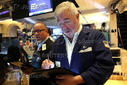 Traders work on the floor of the NYSE in New York