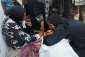 Mourners attend the funeral of Palestinians who were killed, according to medics, in Israeli fire, at Al-Shifa hospital, in Gaza City