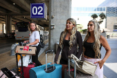 Israeli nationals arrive at Ben Gurion International airport from abroad, in Tel Aviv