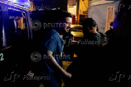 Arturo Suarez, who was held for months in an El Salvador prison, greets family members after his release, in Caracas
