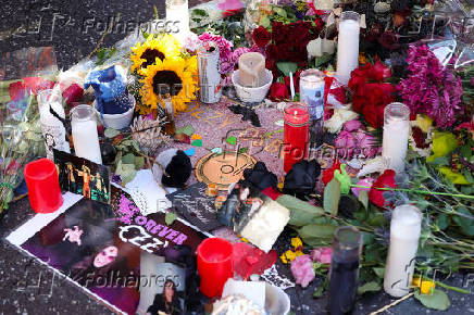 Flowers and pictures are placed on the star of late Ozzy Osbourne at the Hollywood Walk of Fame in Los Angeles