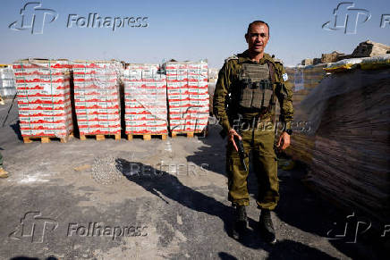 Humanitarian aid is waited to be transferred into Gaza from Israel, at the Gaza part of the Kerem Shalom crossing in the Gaza Strip