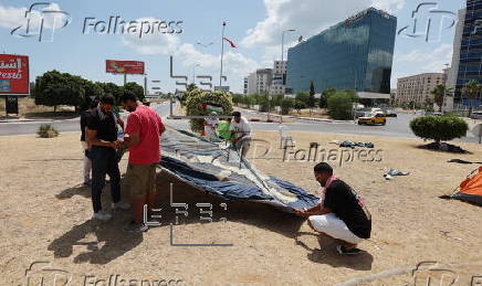 Pro-Palestinian demonstrators pitch protest camp in front of US embassy in Tunis