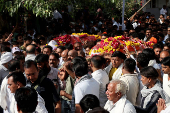 People carry the bodies of Yatish Parmar and his son Smit Parmar, who were killed in a suspected militant attack near Pahalgam in south Kashmir, for their last rites in Bhavnagar