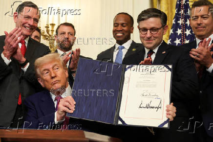 U.S. President Trump signs a resolution at the White House
