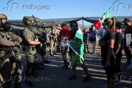U.S. federal agents and immigration officers raid an agricultural facility in Camarillo