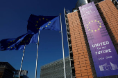 European Union flags flutter outside the European Commission headquarters in Brussels