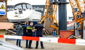 Tower crane falls on workboat in Maasbracht, Netherlands