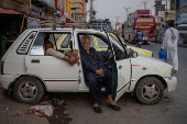 Taxi drivers await customers in Rawalpindi, Pakistan