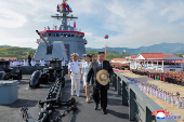 North Korean leader Kim Jong Un attends the launching ceremony of a warship that had been damaged upon its first attempt to launch