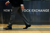 Traders work on the floor of the NYSE in New York