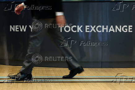 Traders work on the floor of the NYSE in New York