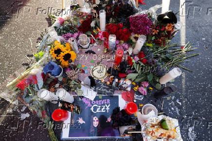 Flowers and pictures are placed on the star of late Ozzy Osbourne at the Hollywood Walk of Fame in Los Angeles