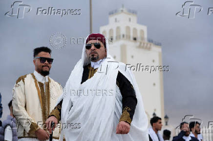 People gather to celebrate Eid wearing traditional Libyan outfits in Benghazi