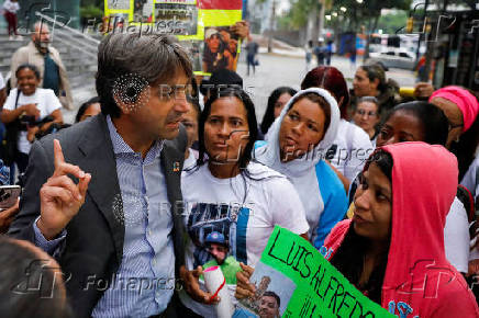 Family members of migrants imprisoned in El Salvador protest outside the United Nations building, in Caracas