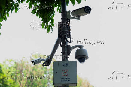 Installed Closed Circuit Television (CCTV) cameras are seen in a street in New Delhi