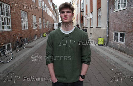 Harvard student Alfred Williamson, who comes from Wales, stands in a street in Copenhagen