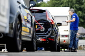 Vacationers have their vehicles checked at the border crossing with Belgium