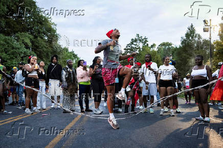 Revelers attend J'ouvert celebration on the day of the annual West Indian Day parade in the Brooklyn borough of New York