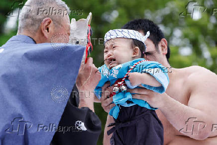 Babies take part in 'Nakizumo' or baby crying sumo contest at Senso-ji temple in Tokyo