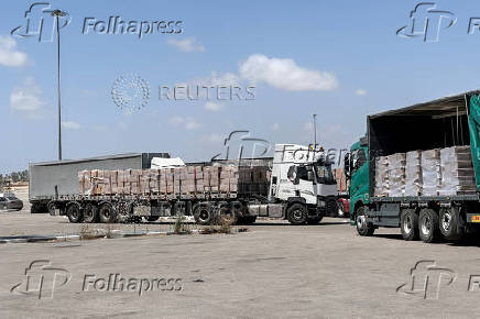 Trucks carrying aid are seen at the Kerem Shalom crossing between Israel and Gaza, on its Israeli side
