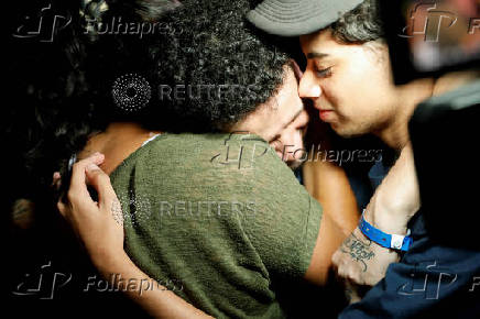 Arturo Suarez, who was held for months in an El Salvador prison, greets family members after his release, in Caracas