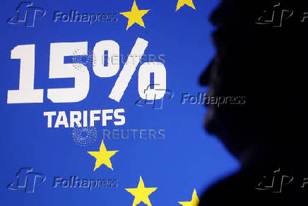 Illustration shows 3D-printed miniature of U.S. President Donald Trump, EU flag and words 