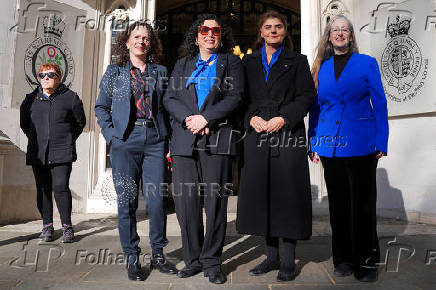 People await a ruling on an appeal by For Women Scotland outside the Supreme Court in London