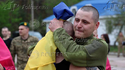 Ukrainian POWs are seen after a swap at an unknown location in Ukraine