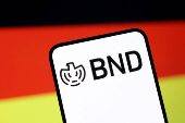 Illustration shows BND (Bundesnachrichtendienst) logo and German flag