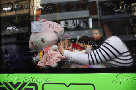 Migrants outside the Venezuelan embasssy waiting for a flight back to their country