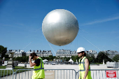 The return of a new Paris 2024 flame cauldron set on a balloon to the Tuileries Garden and the Paris skyline
