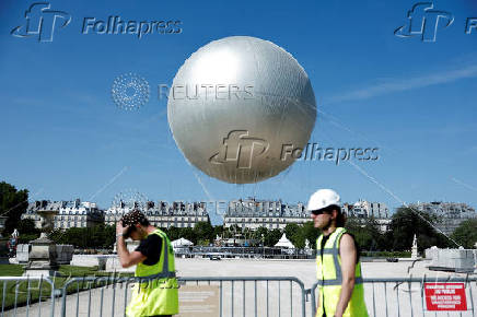 The return of a new Paris 2024 flame cauldron set on a balloon to the Tuileries Garden and the Paris skyline
