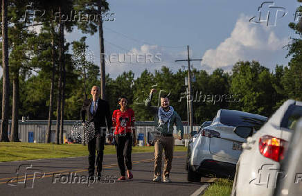 Columbia University graduate student Mahmoud Khalil gestures as he is released from immigration custody in Jena